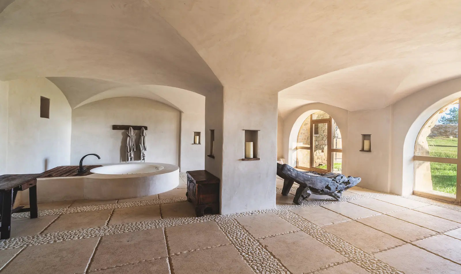 Luxury spa interior featuring custom reinforced concrete cross vaulted ceilings with elegant, minimalist architecture.